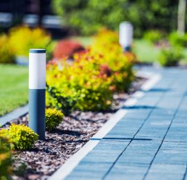 Cobblestone Brick Path in the Garden with Elegant and Modern LED Lighting.